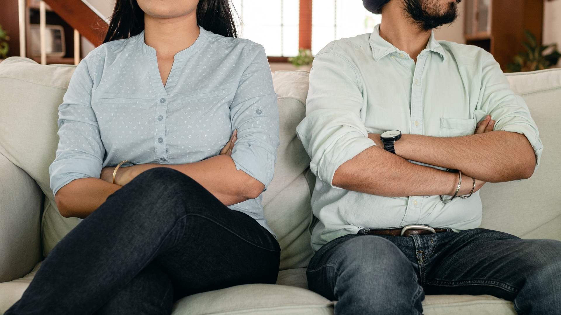 man and woman sitting following the rules without the relationship