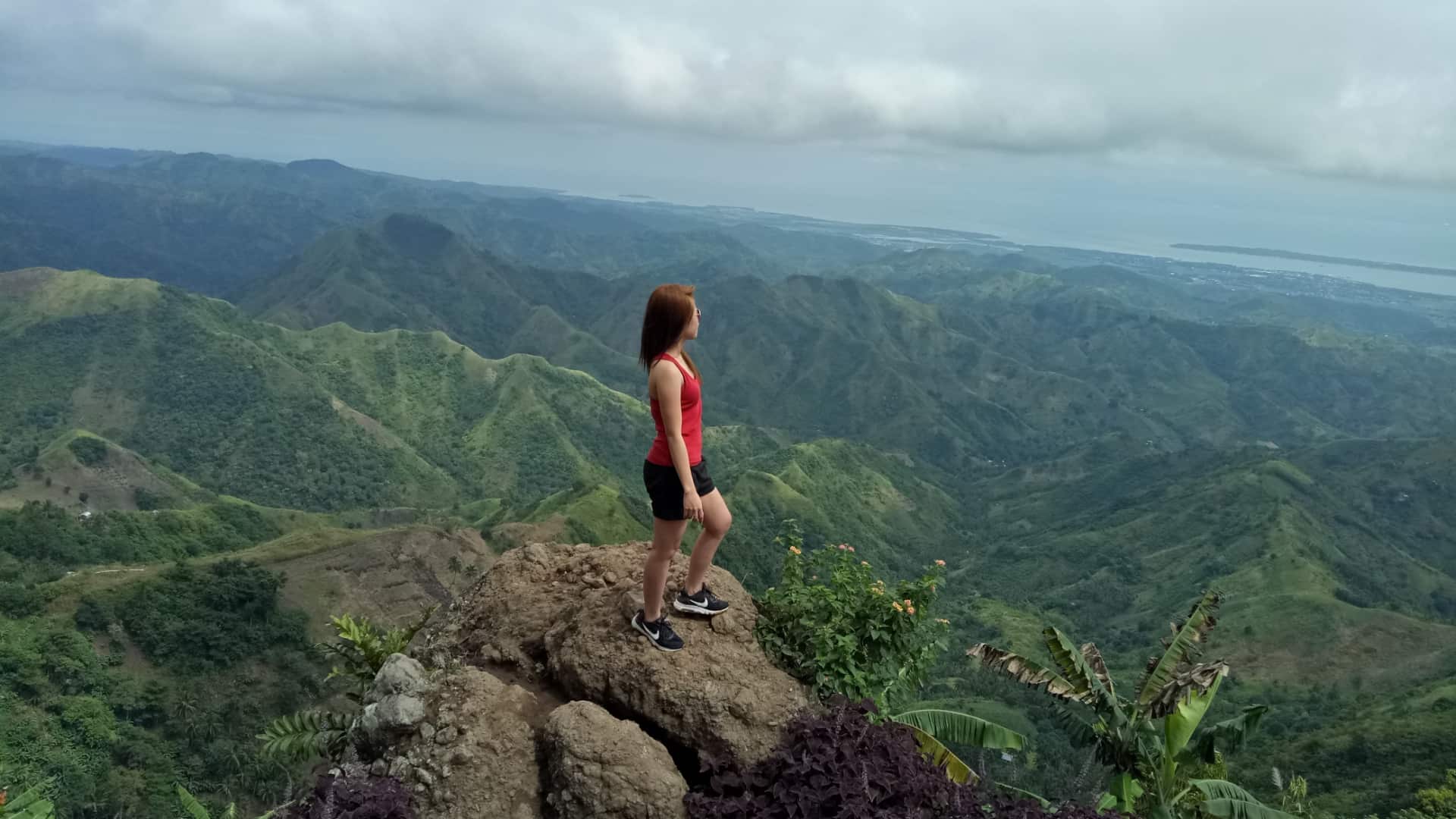 woman-on-top-of-mountain satisfied with life