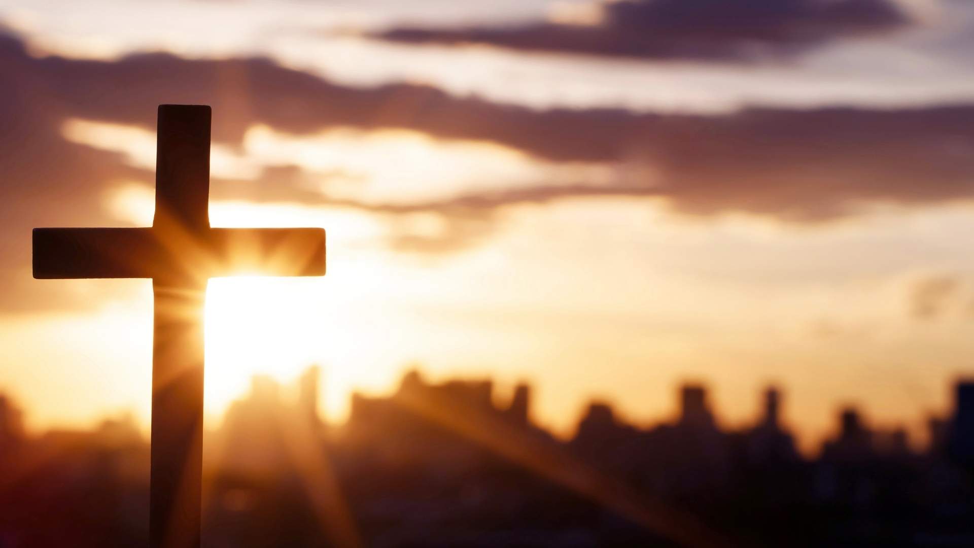 wooden cross at sunset