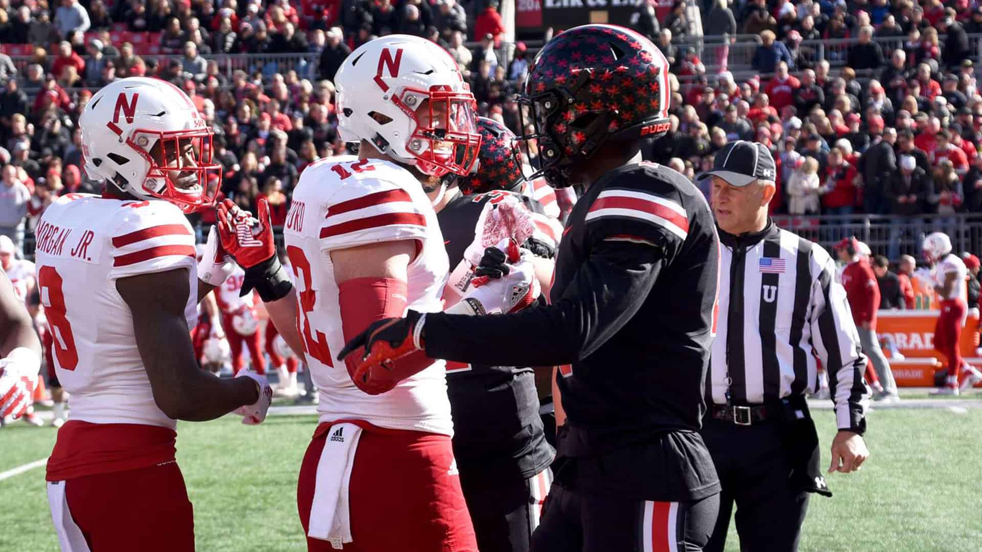 football-players-shaking-hands demonstrating blessing your enemies