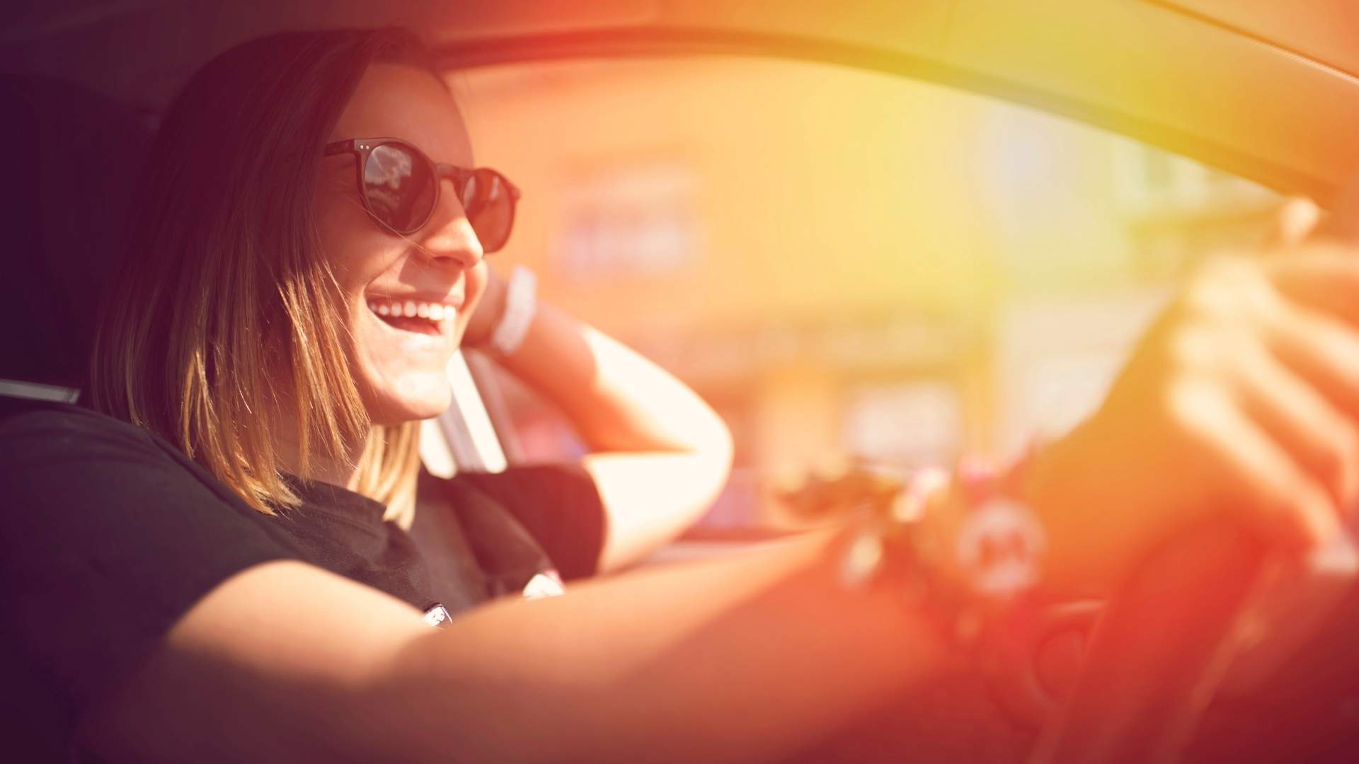 woman driving and enjoying the ride