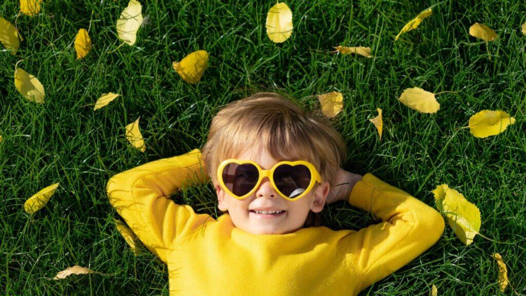 boy wearing yellow sunglasses