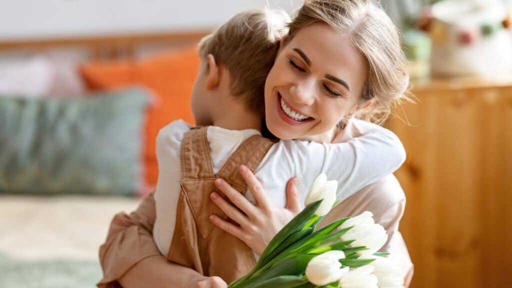 child and female hugging depicting the magic of a thankful heart