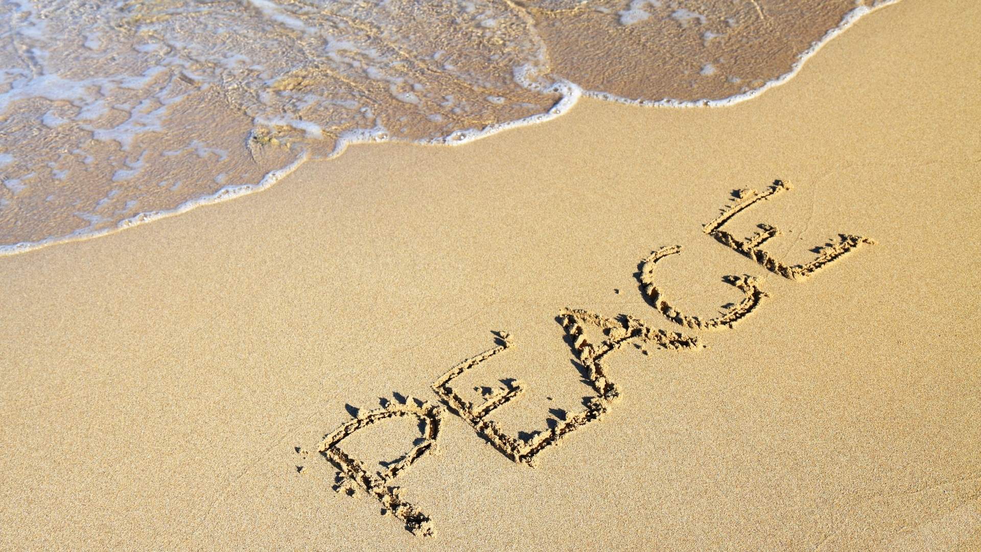 Peace written in sand
