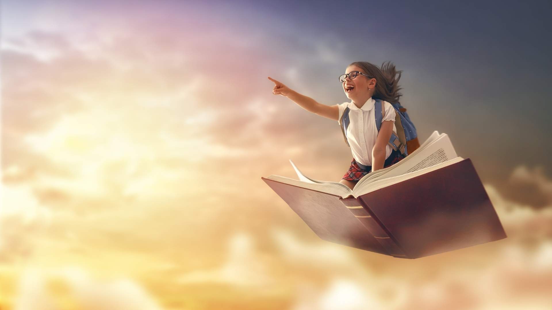 girl flying on a book exercising her imagination