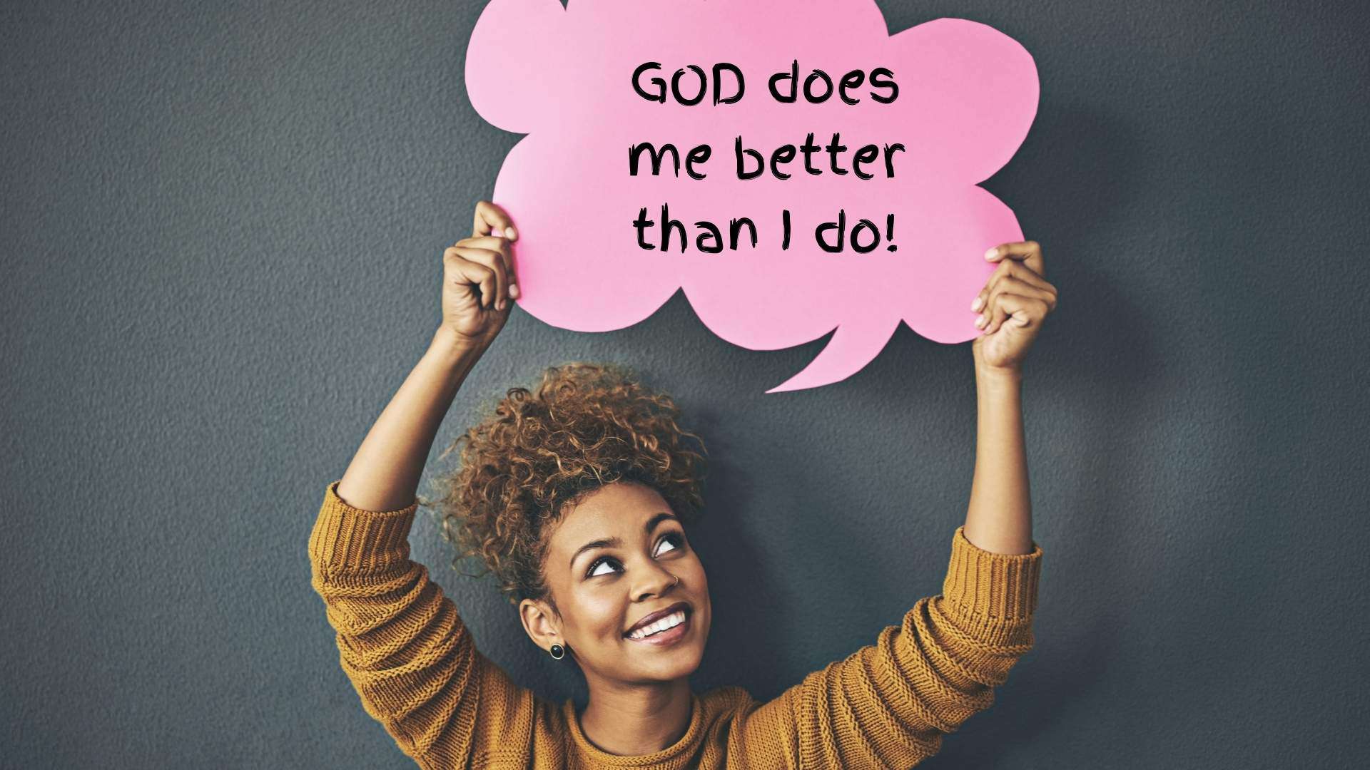 Black woman holding sign that says "God does me better than I do."