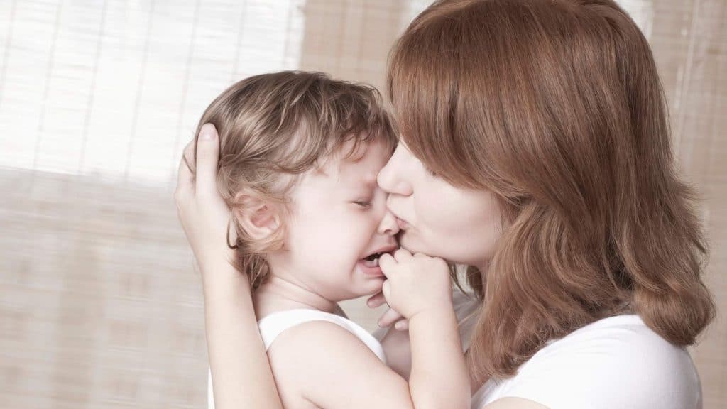 mom comforting a child