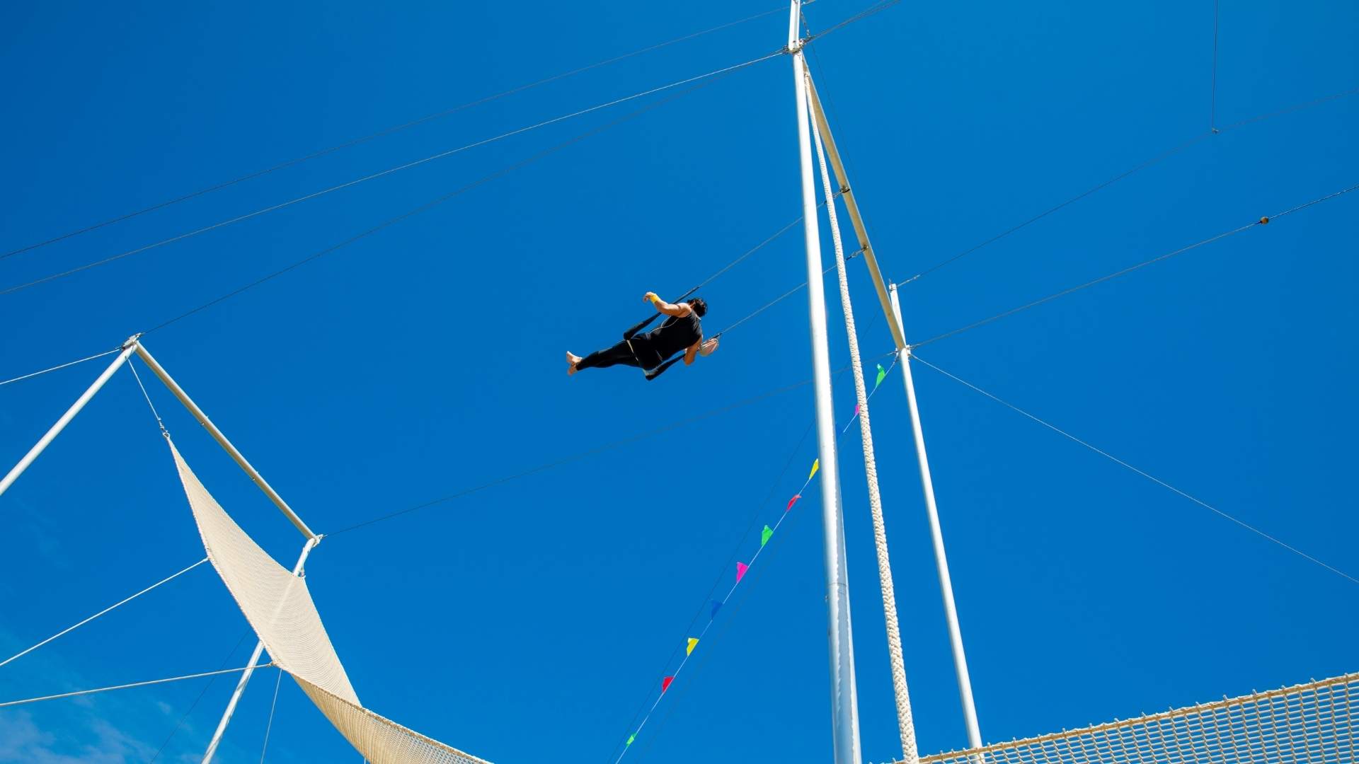 trapeze artist with safety net