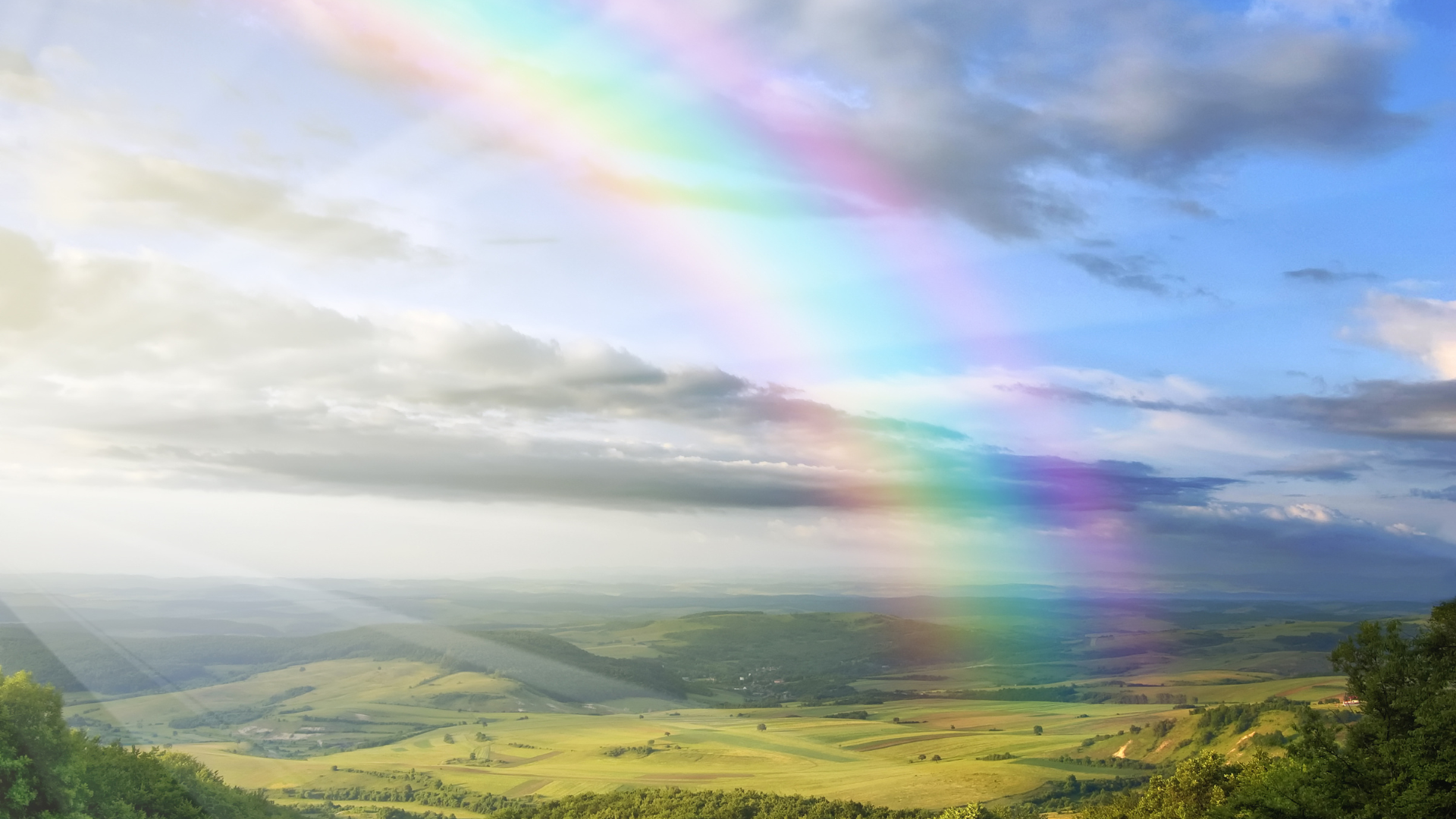 Rainbow over valley represents God's kept promises and why we can trust God. He fulfills his promises