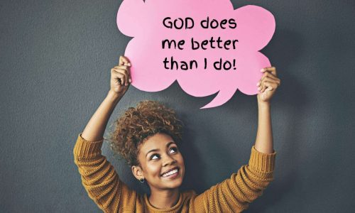 Black woman holding sign that says "God does me better than I do."