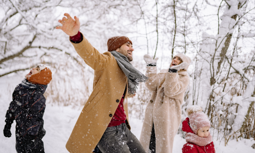 Family playing in snow