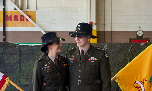 Jon and wife in uniform