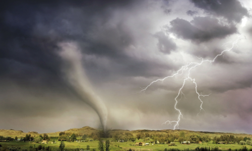 Image of a storm with a tornado hitting a valley