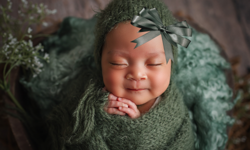 baby in green with bow