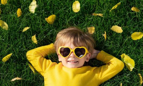 boy wearing yellow sunglasses