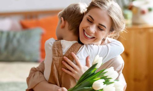 child and female hugging depicting the magic of a thankful heart