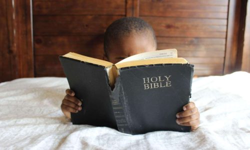 child reading bible