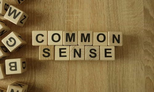 common sense spelled on letter blocks