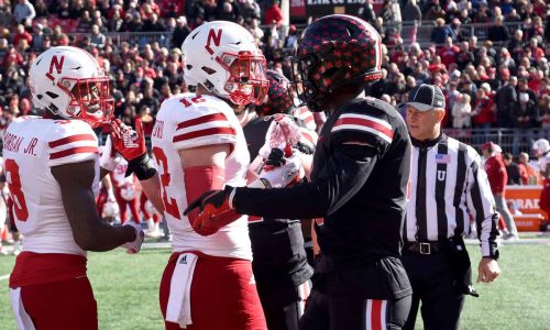 football-players-shaking-hands demonstrating blessing your enemies