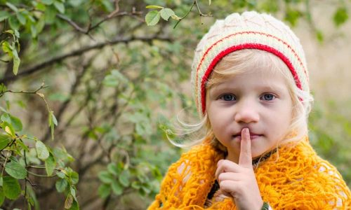 Spiritual silence as represented by this photo of little girl with finger to lips