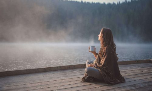 girl on dock on lake