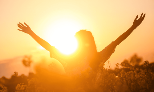 girl with hands in air