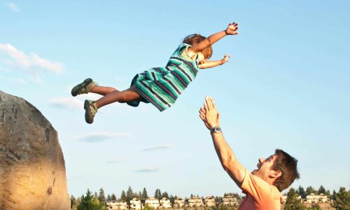 kid jumping to parent