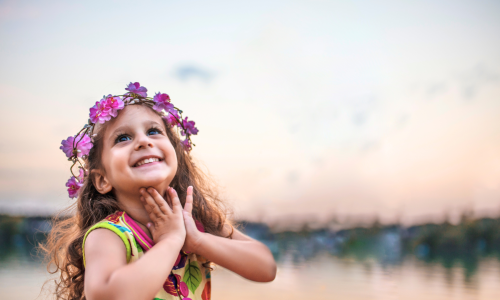 little girl looking up to the sky