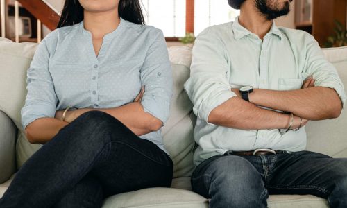 man and woman sitting following the rules without the relationship