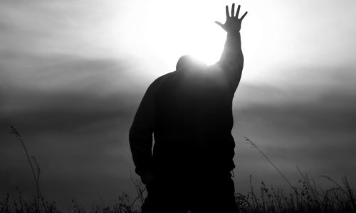 man kneeling in prayer