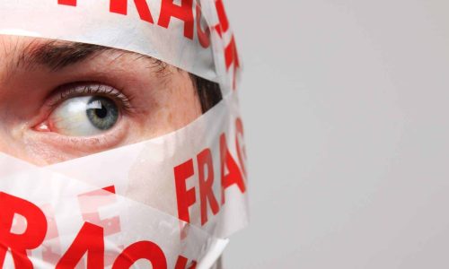 man wrapped in fragile tape