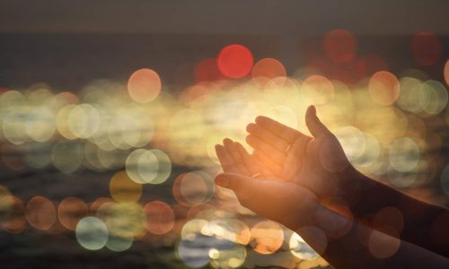 prayer_hands_bokeh