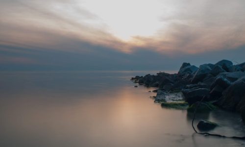 rocks ocean sunrise