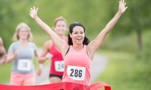 runner crossing the finish line