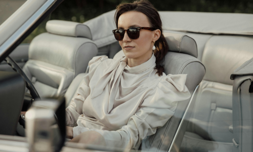 woman in a fancy car